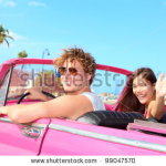 stock-photo-couple-happy-in-vintage-retro-convertible-car-friends-driving-on-summer-road-trip-in-pink-car-99047570