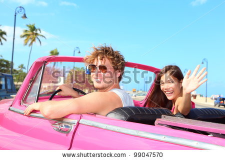 stock-photo-couple-happy-in-vintage-retro-convertible-car-friends-driving-on-summer-road-trip-in-pink-car-99047570